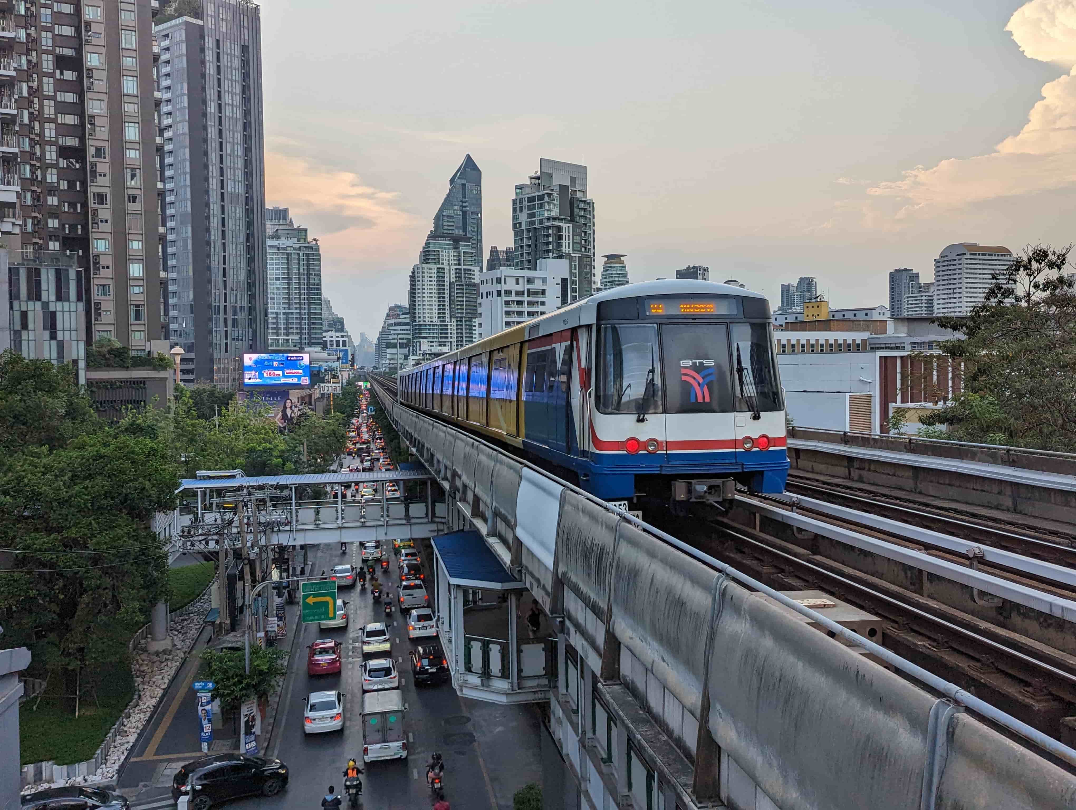 BTS train driving over a bridge in Taiwan with the city in the background